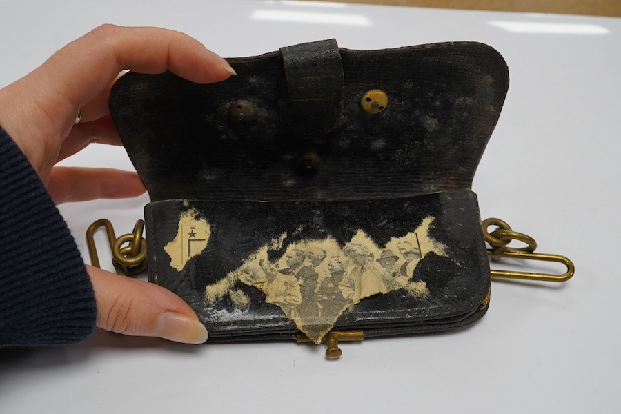 A Victorian Royal Artillery leather and brass cartridge pouch, 15cm wide. Condition - fair